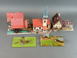 une petite maquette de ville avec un train sur les rails