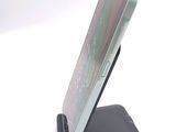 a cell phone that is sitting on top of a stand