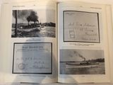 an open book with pictures of boats on the water