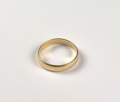 an image of a gold ring on a white surface