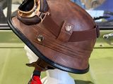 a helmet with goggles on top of it on a mannequin head