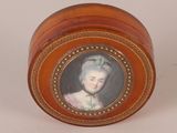 a small box with a picture of a woman on it