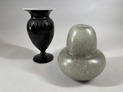 two vases sitting next to each other on a table
