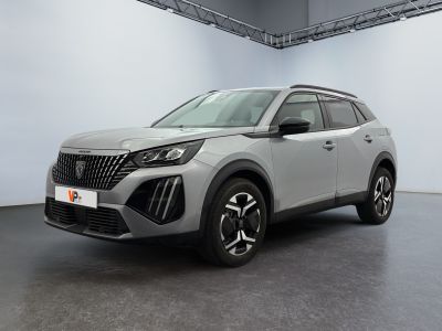 a silver suv is parked in a large room with a white wall