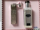 a bottle of perfume and a lighter in a pink box