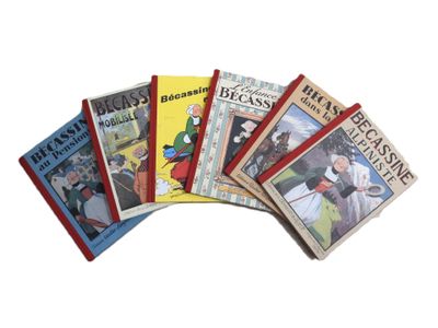 plusieurs livres pour enfants sont alignés sur une surface blanche