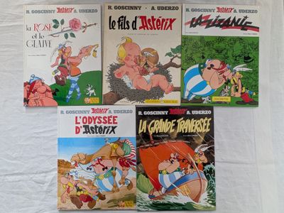 plusieurs livres pour enfants sont alignés sur une surface blanche