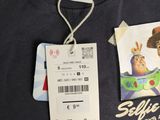 a t - shirt with a picture of a cartoon character on it