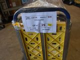 a cart that has a sign on it in a store