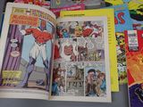 many comic books spread out on a table