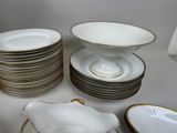 a lot of plates and bowls on the table