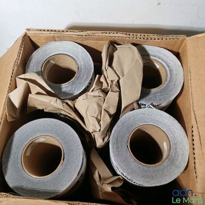 four rolls of duct tape in a cardboard box