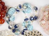 a lot of different bracelets that are on a table