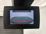 the rear view mirror of a vehicle with a camera attached to it