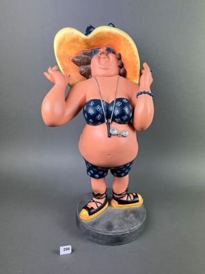 figurine of a woman in a bikini with a hat and sunglasses