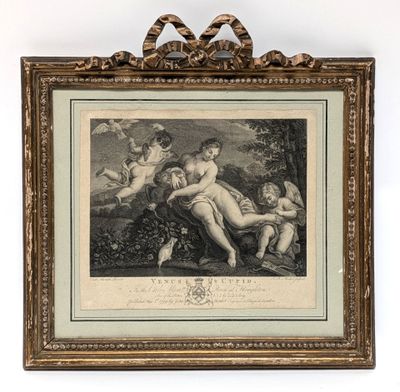 a framed picture of a woman and two children in a wooded setting