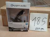 a box of oxygen audio products on a table next to a box with a price tag