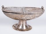 a silver bowl with a lid on a stand