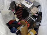 a bag full of clothes and other items in it