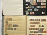 an open book with stamps on it on a table