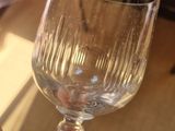 a person holding a wine glass in their hand