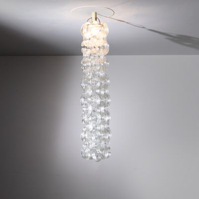 a chandelier hanging from the ceiling in a room