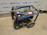an image of a blue generator sitting on top of a cement floor
