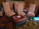 several chairs and a table in a room with a fire place