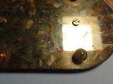 a close up of a metal plate with buttons on it