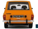 an orange car with a license plate on the back of it