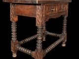 an old wooden table with a drawer on top of it