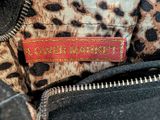an image of a close up of a purse with a label on it