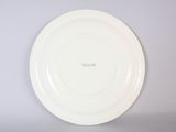 a white plate that has a black writing on it