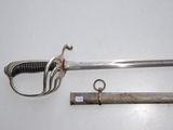 a knife and a sword on a white surface