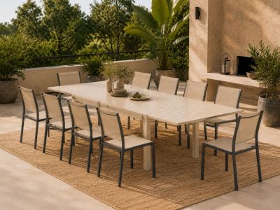 a table and chairs on a patio with a fireplace in the background