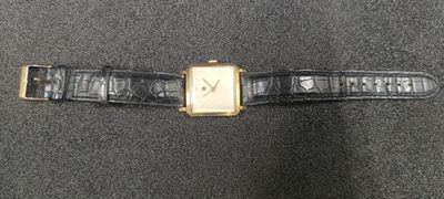 a close up of a wrist watch with a black strap