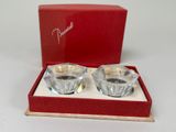 pair of crystal candle holders in a red box on a white surface