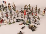 a lot of figurines that are sitting on a table
