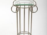 an image of a glass table with a metal frame and a glass top
