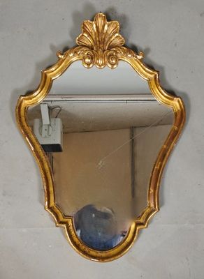 a mirror hanging on the wall in a room