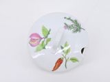 a white plate with a picture of vegetables and herbs on it