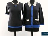 two women ' s black and blue sweaters on mannequins