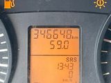 a close up of a car dashboard with a clock on it