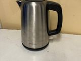 a kettle that is sitting on the counter in the kitchen