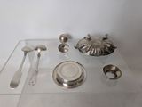 a glass table with silverware and spoons on it