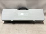 a close up of a silver case with a black handle