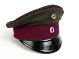 a military hat with a red button on it