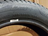 tires are stacked on top of cardboard boxes in a room