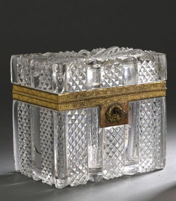 a clear glass box with a gold trim around it