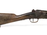 a close up of a rifle on a white background with a white background